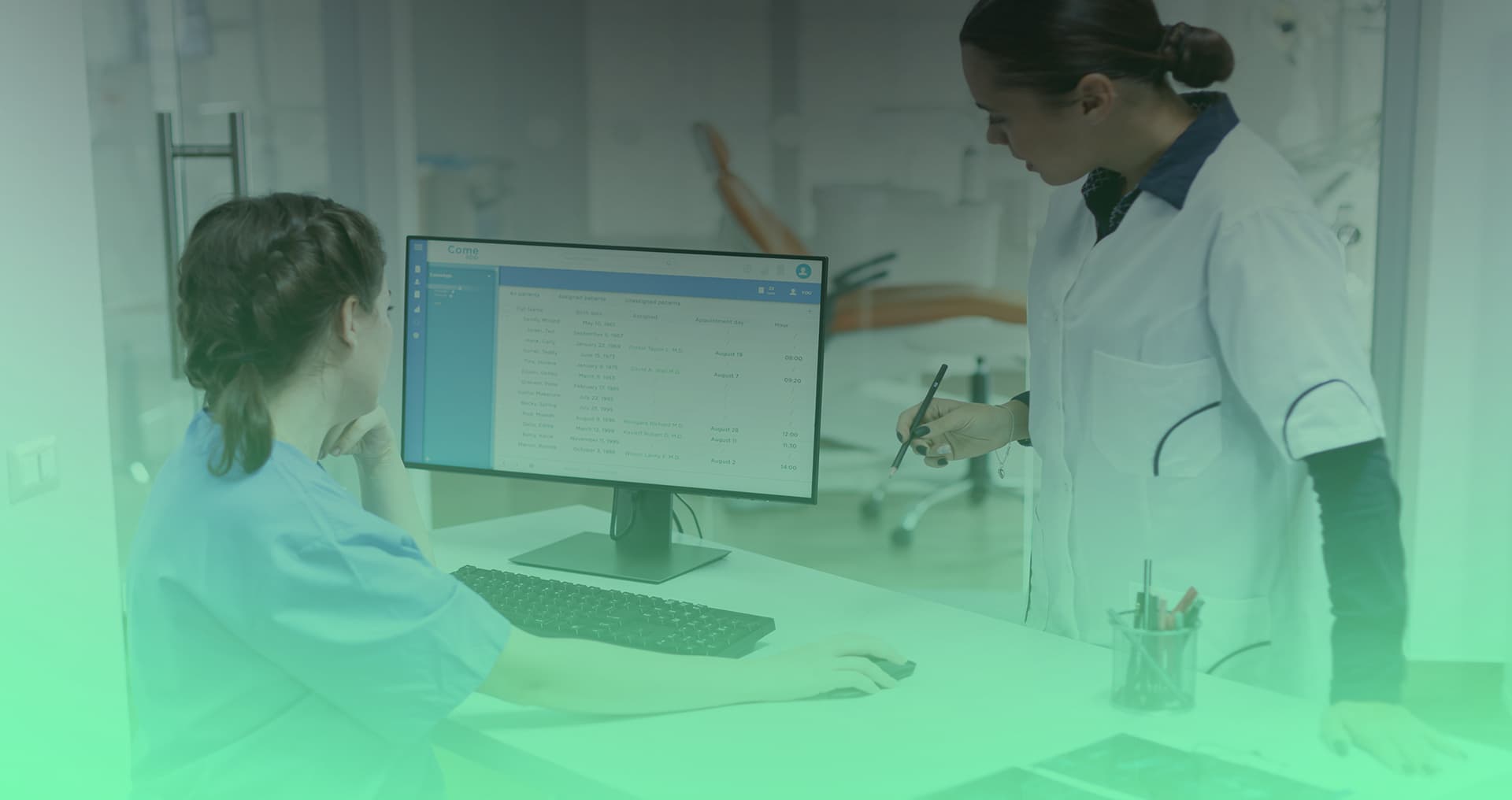 Dental professionals reviewing practice management software